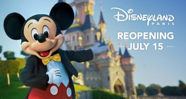 Mickey Mouse greets guests in front of Disneyland Paris castle, with “Reopening July 15” signage welcoming everyone back.