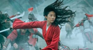 Epic live-action show featuring a heroine in a red robe brandishing a sword, with costumed warriors clashing behind her on stage.