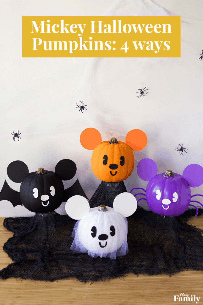 DIY Mickey Mouse pumpkins in black, orange, white, and purple with bats and spiders create a festive Disney Halloween display.