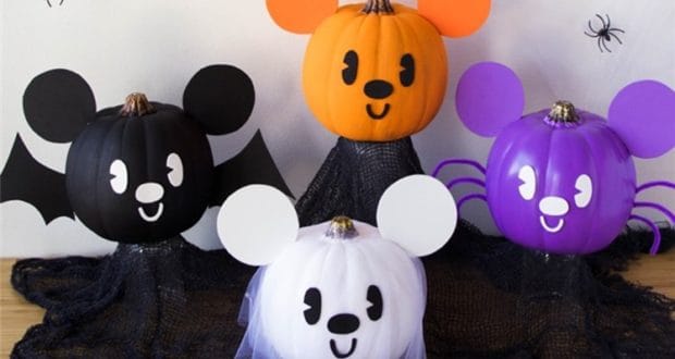 Four pumpkins transformed into adorable cartoon animals with big ears, featuring Mickey’s Halloween magic, bats, and spiders.