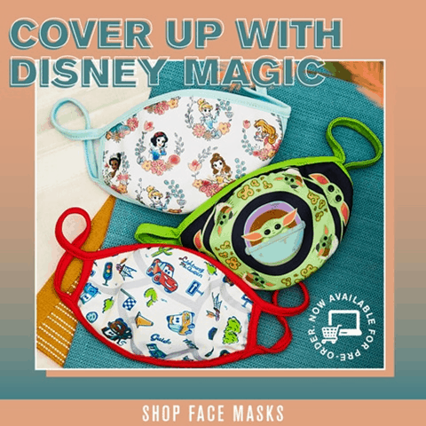 Disney face masks from BoxLunch featuring beloved characters, perfect for your next visit to the parks, displayed on a cloth.