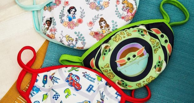 Disney-themed kids’ face masks with vibrant character designs from BoxLunch, perfect for your next magical park adventure, on display.
