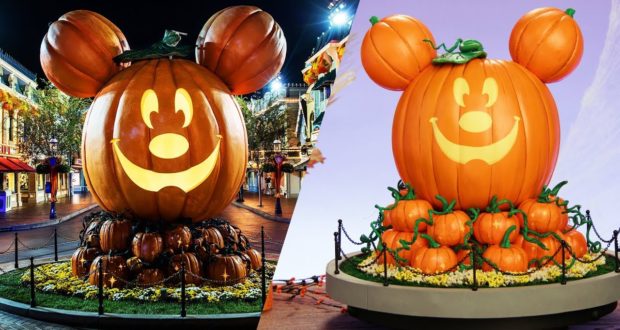 Giant DIY Mickey Pumpkin and mini replica glow on Main Street, surrounded by festive pumpkins for Halloween at Disney Parks.