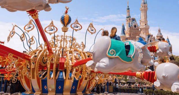 A mother and her child riding Dumbo at Shanghai Disneyland