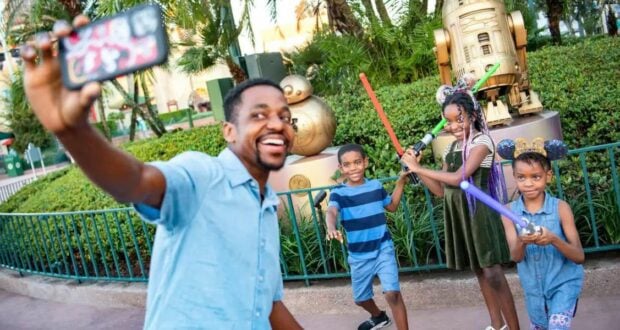 Family Poses for Selfie at Disney World in Central florida