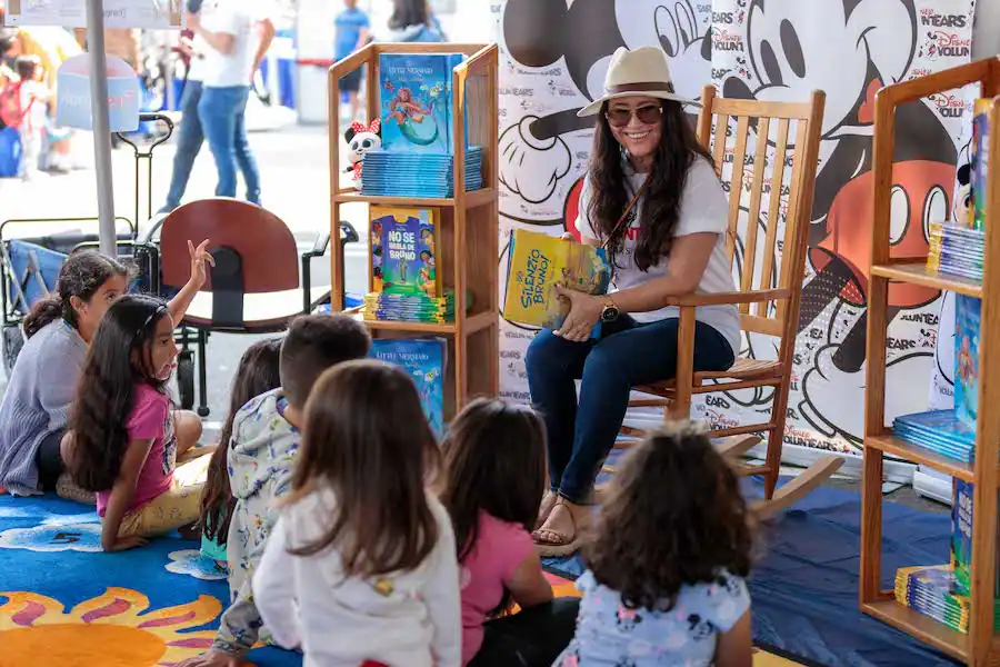 Cast Member reading book