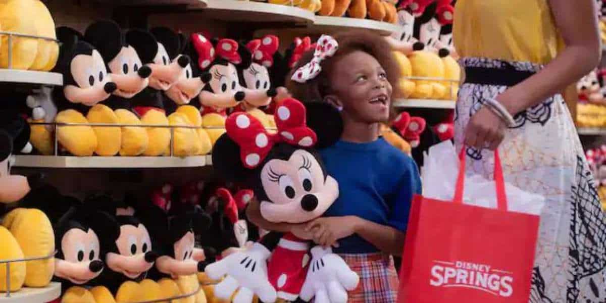 Girl Holding Minnie Mouse at Disney Springs