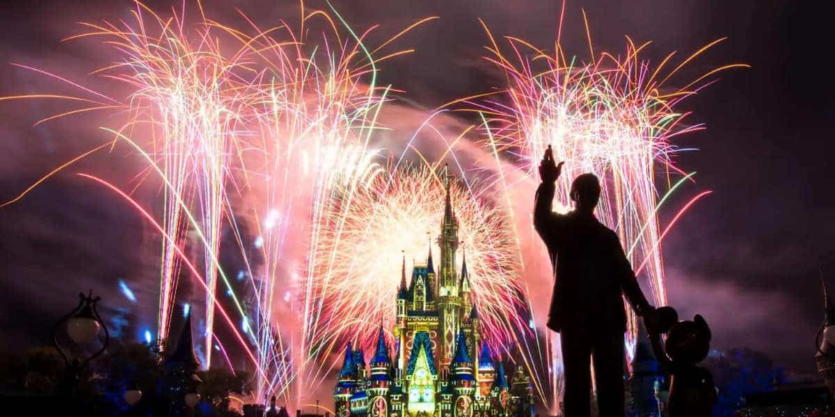 Fireworks at Cinderella Castle with Walt Disney Statute