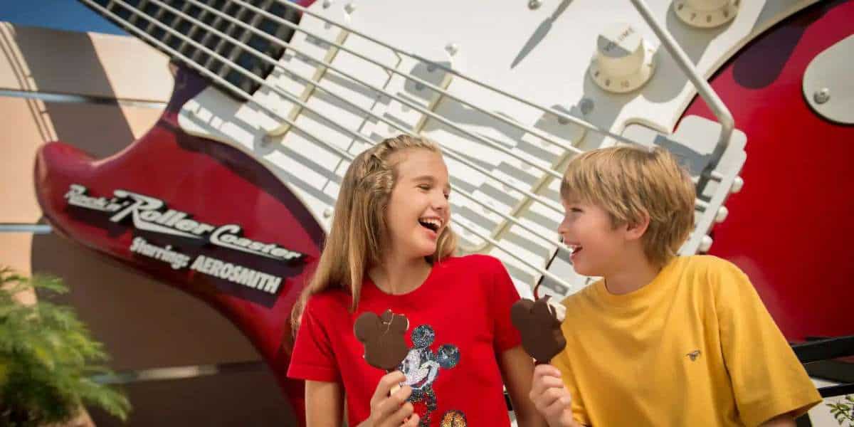Kids eating Mickey Ice Cream outside Rock N Roller Coaster