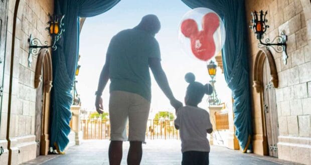 Dad and child walking through castle