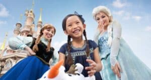 Disneyland Paris guest with Anna and Elsa