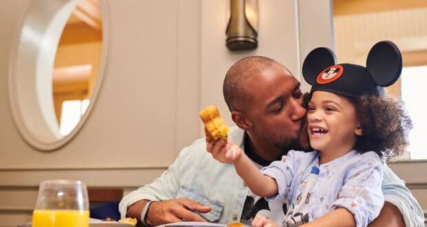 A father and son dining together at Disney World.