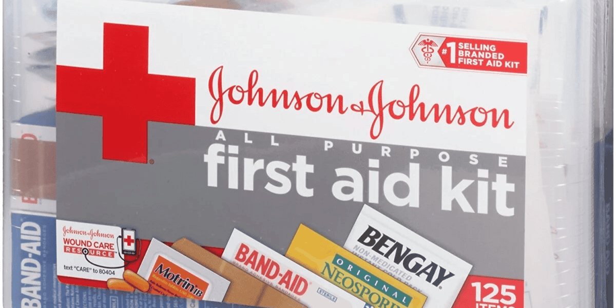 Close-up of a Johnson & Johnson All Purpose First Aid Kit. Perfect for what to pack for Disney World, the kit includes essentials like Band-Aids, Bengay, and Neosporin. Touted as the #1 selling branded first aid kit, it features 125 items, ensuring you're prepared for any park adventure.