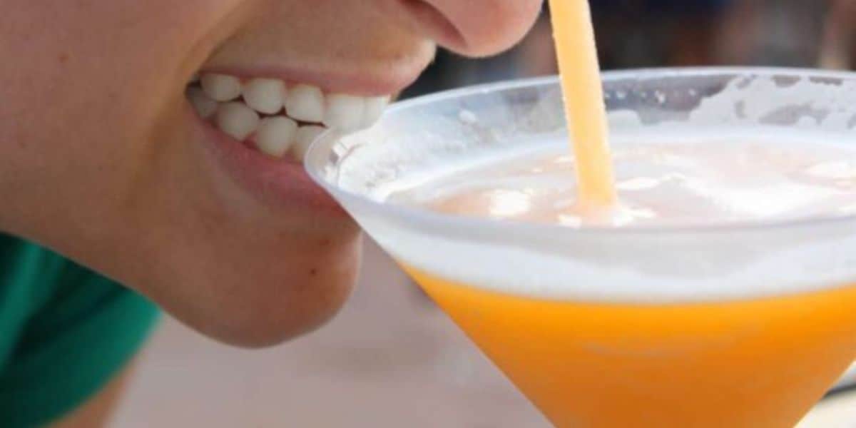 A person drinking a margarita.