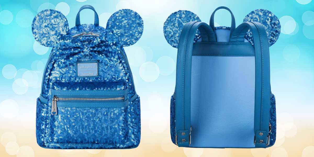 A stylish blue backpack adorned with sparkly sequins and large mouse ears is shown from both the front and back, perfect for any Disney Giveaway. The front features a zippered pocket and a decorative patch, while the back has solid blue straps and a handle. The background is a soft, blurred bokeh.