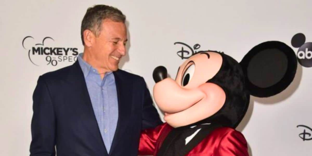 Bob Iger and Mickey Mouse smile at each other