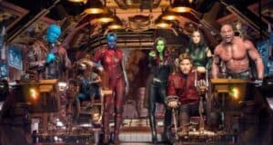 A group of seven diverse characters in a futuristic setting. They stand and sit in a spaceship, dressed in various colorful outfits. The background is filled with advanced technology and control panels.