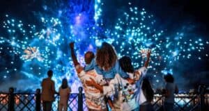 A group of guests watch fireworks at EPCOT