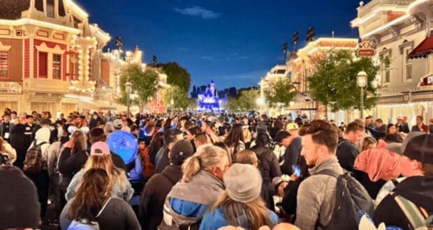 Crowds at Disneyland Park in front of Sleeping Beauty Castle