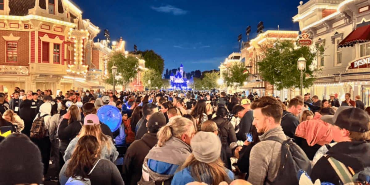 Crowds at Disneyland Park in front of Sleeping Beauty Castle