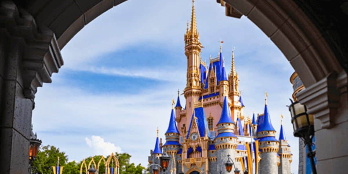 Cinderella Castle in Magic Kingdom at Walt Disney World Resort as seen from an archway.