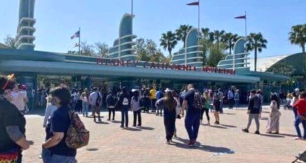 Guests walking into Disney California Adventure Park at Disneyland Resort.