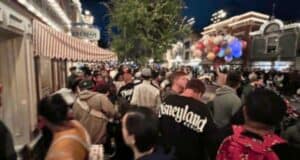 A large crowd of people on Main Street, U.S.A. at Disneyland Park in Anaheim, California.