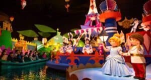 Guests enjoy a ride on "it's a small world," surrounded by colorful, animated dolls representing different cultures from around the world.