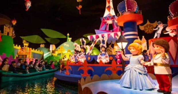Guests enjoy a ride on "it's a small world," surrounded by colorful, animated dolls representing different cultures from around the world.