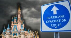 A hurricane evacuation sign with the Magic Kingdom castle and stormy weather in the background
