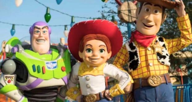 Buzz, Woody, and Jessie pose in front of Toy Story Land at Disney's Hollywood Studios