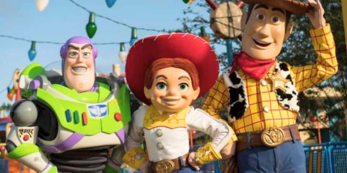 Buzz, Woody, and Jessie pose in front of Toy Story Land at Disney's Hollywood Studios