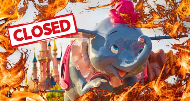 A colorful amusement park ride featuring a flying elephant is surrounded by animated flames. A red "CLOSED" sign is prominently displayed across the image. In the background, a whimsical castle can be seen.