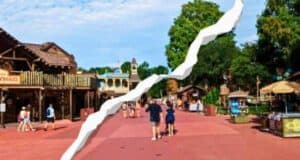 Low crowds at Magic Kingdom's Frontierland with rip diagonally across the image