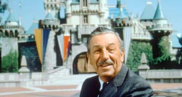 Walt Disney in front of Sleeping Beauty Castle