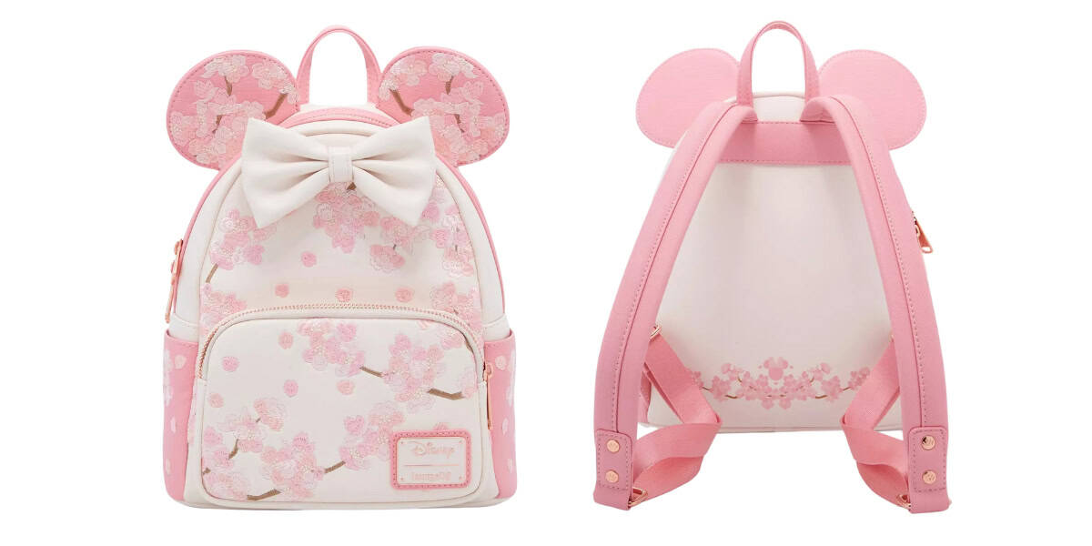 Front and back view of a pink and white backpack featuring mouse ears and a bow. The bag has cherry blossom patterns and pink straps. It includes a zippered front pocket.