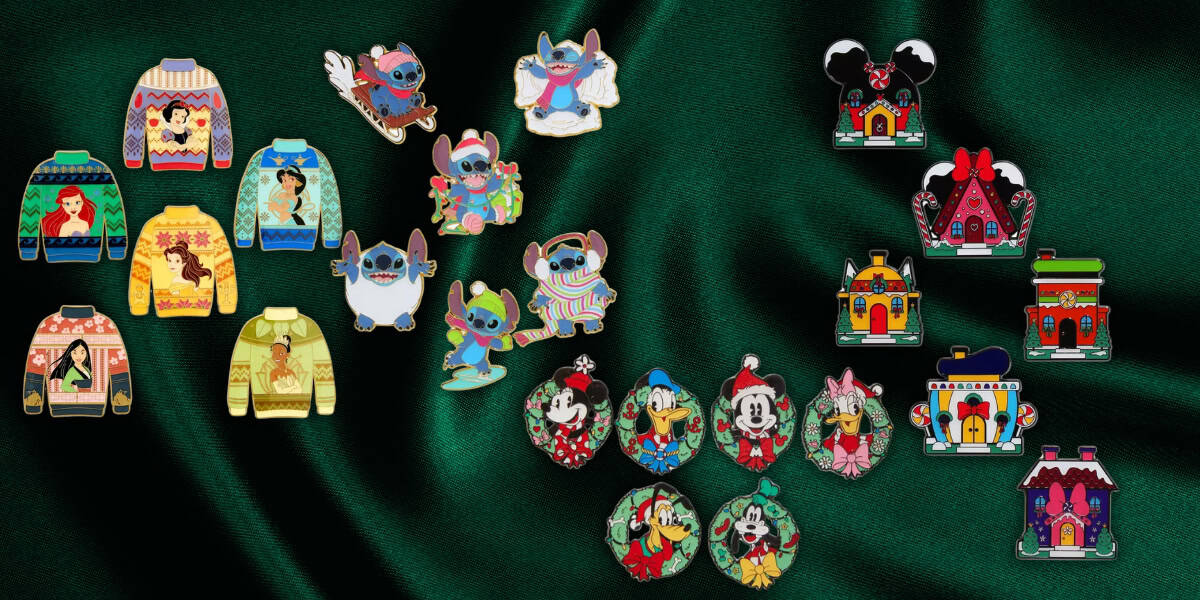 A collection of colorful enamel pins placed on a dark green fabric. The pins feature Disney characters, festive sweaters, themed ornaments, and miniature gingerbread houses, showcasing various holiday and cartoon designs.