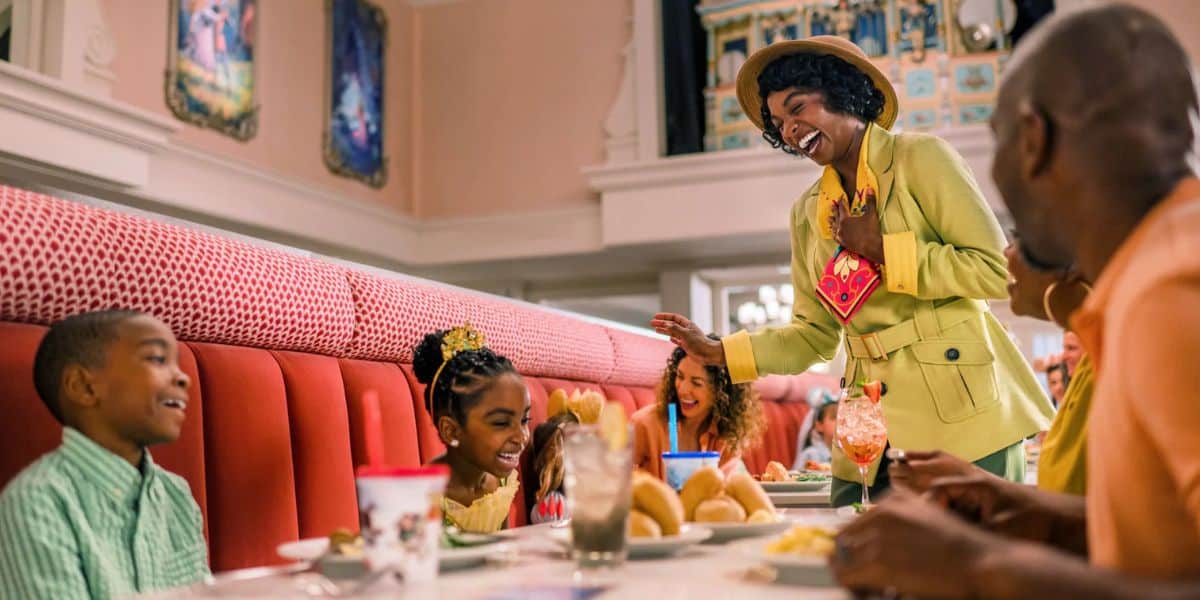 Tiana greets a table at 1900 Park Fare at the Grand Floridian
