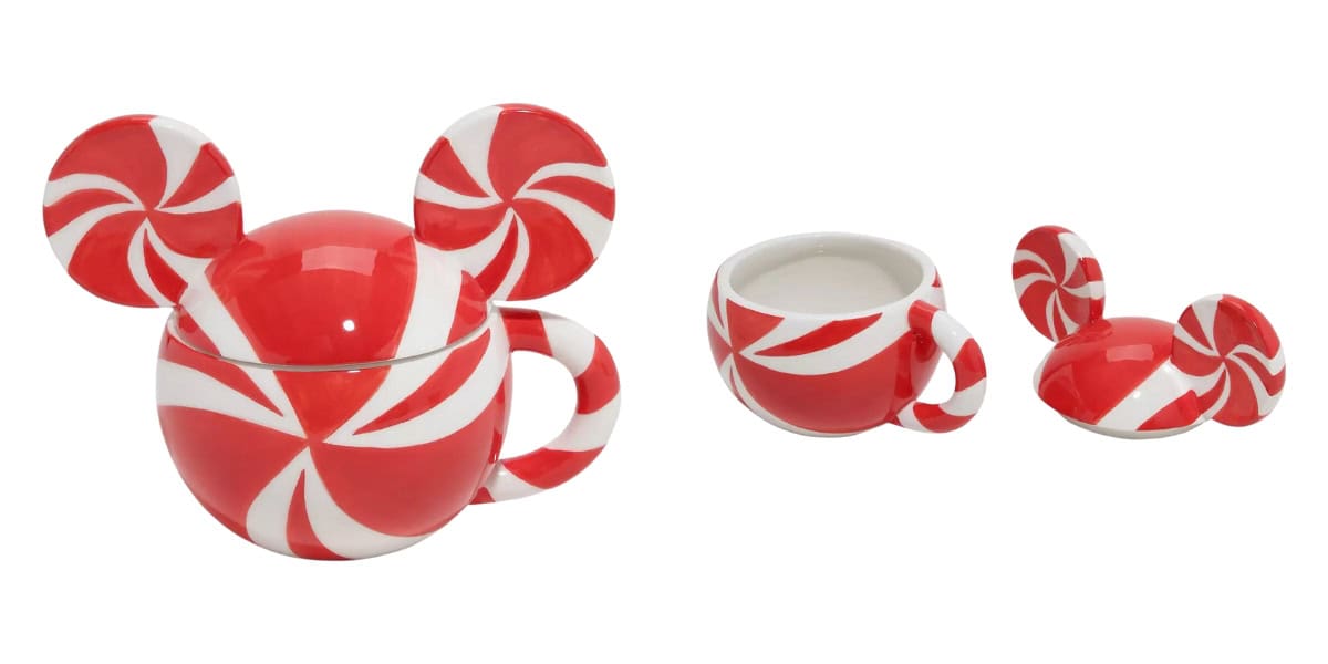 Red and white ceramic cup and lid set, designed with swirling peppermint patterns. The cup has a round shape with a handle, and the lid features two circular accents resembling ears, matching the peppermint design.