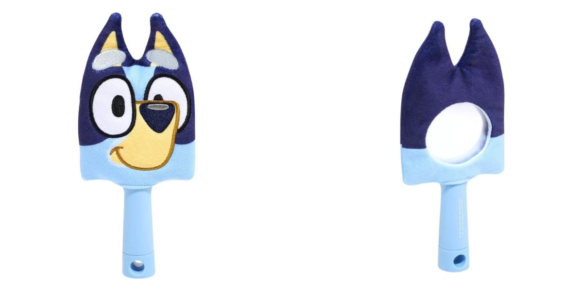Two views of a blue toy brush with a character's face on the front and ears at the top. The back shows a round mirror. The handle is light blue with a hole at the end.