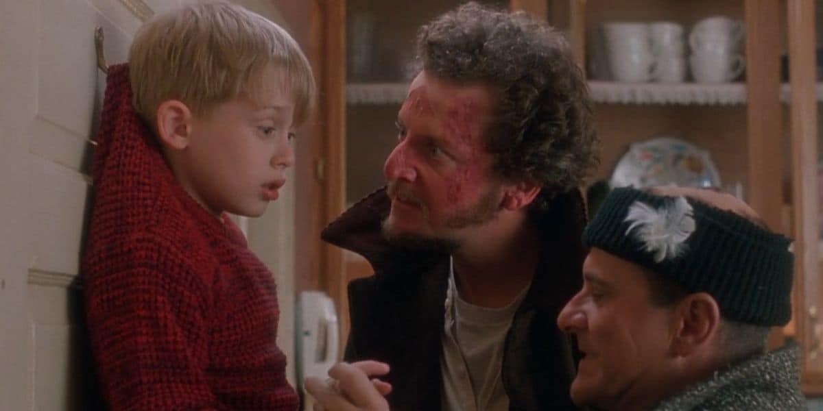 Kevin McCallister (Macaulay Culkin) is hooked on the wall by Harry and Marv (Joe Pesci and Daniel Stern) in 'Home Alone'