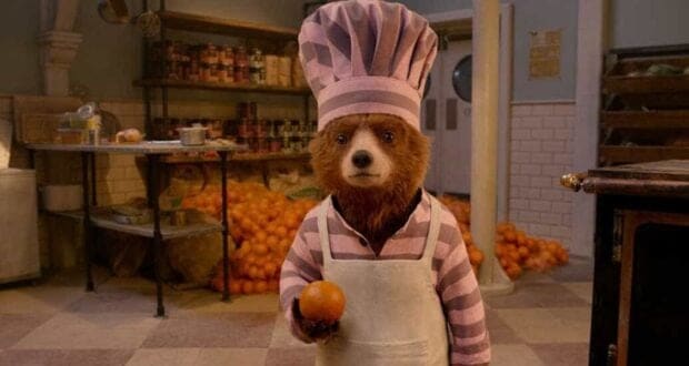 Paddington Bear in the jail kitchen in 'Paddington 2'