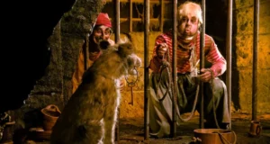 Dog outside jail containing pirates on Pirates of the Caribbean