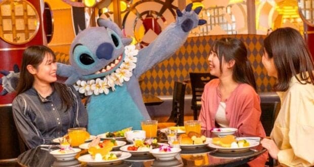 Stitch with three adults at character dining at Tokyo Disney Resort