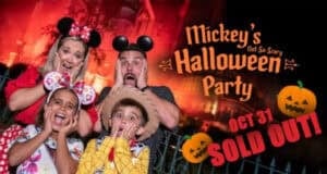 Four people in Disney costumes pose with surprised faces by a spooky, red-lit building at Disney World. Text: "Mickey’s Not-So-Scary Halloween Party, Oct 31 SOLD OUT!" Pumpkins and Halloween decorations set the scene for Halloween Night.