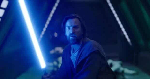 Obi-Wan Kenobi raises his lightsaber