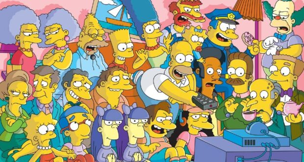 A colorful cartoon group of characters from "The Simpsons" TV show, including Homer, Marge, Bart, Lisa, Maggie, and other residents of Springfield, gathered around a TV in a lively living room scene.