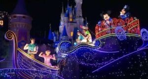 Several characters on Whimsy the train during the Disney Starlight: Dream the Night Away Parade at Magic Kingdom Park