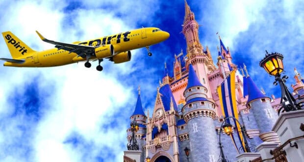 A yellow Spirit Airlines plane flies low above a colorful Disney castle against a bright blue sky with clouds.