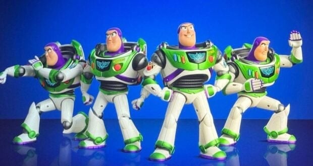 Four Buzz Lightyear action figures from Toy Story stand in different heroic poses against a solid blue background, displaying their green, white, and purple space suits.